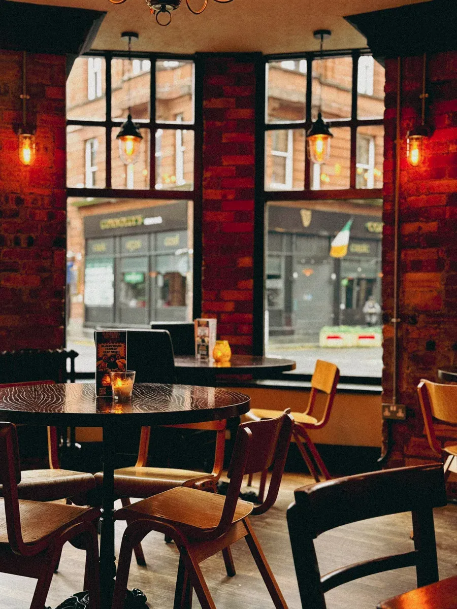 Warmly lit tables and windows inside Blackfriars